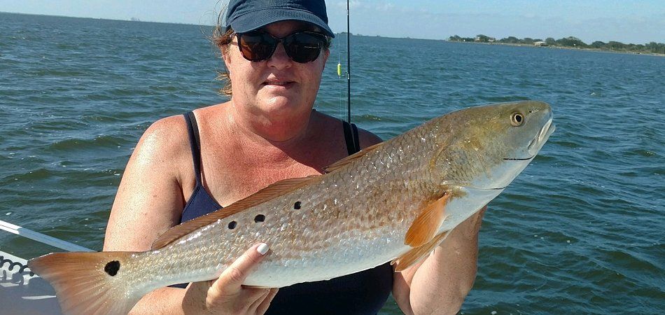 large redfish caught fishing charter