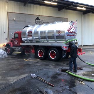 Septic Tank — Man Fixing Septic Tank Tube in Marshfield, MA Septic Tank — Man Fixing Septic Tank Tube in Marshfield, MA