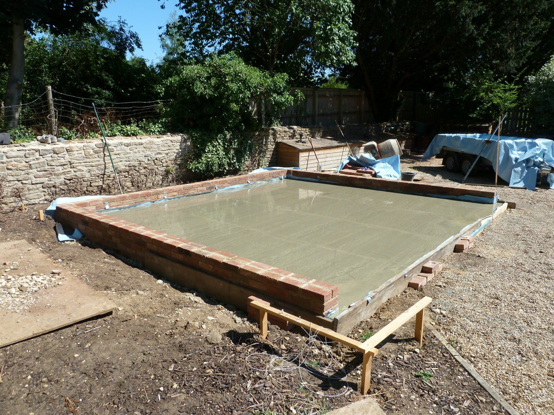 Foundation and slab poured for oak-framed garage in Longworth