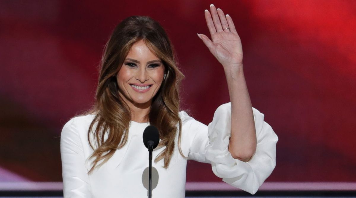 Melania Trump waves on stage