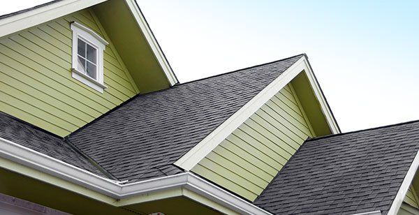 Dark tile roof - Roofing & Construction in Swansboro, North Carolina Dark tile roof - Roofing & Construction in Swansboro, North Carolina