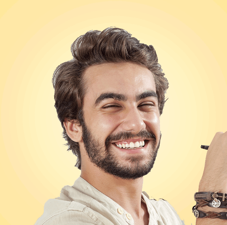Smiling man with beard, brown hair, holding pen, wearing bracelets, set against a yellow gradient background.