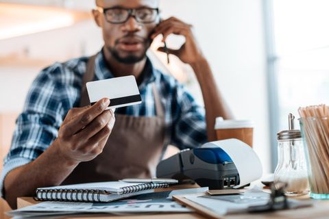 Insurance Agent — Man Holding Card in Fort Pierce, FL