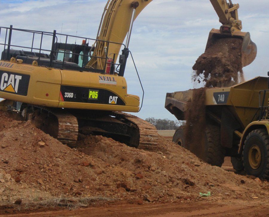 excavator transferring soil