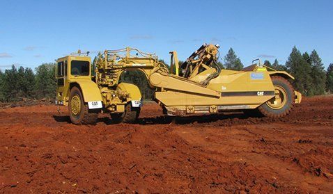 Yellow tructor on field