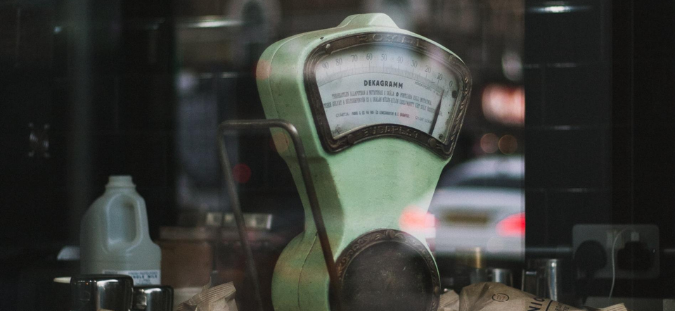 Vintage weighing machine in shop window