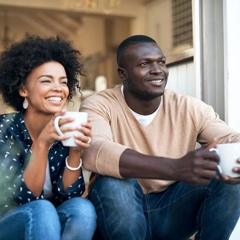 couple with coffee on the porch