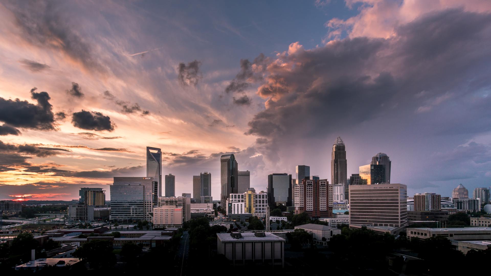 an aerial view of a city skyline at sunset .