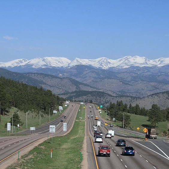 a highway with mountains in the background