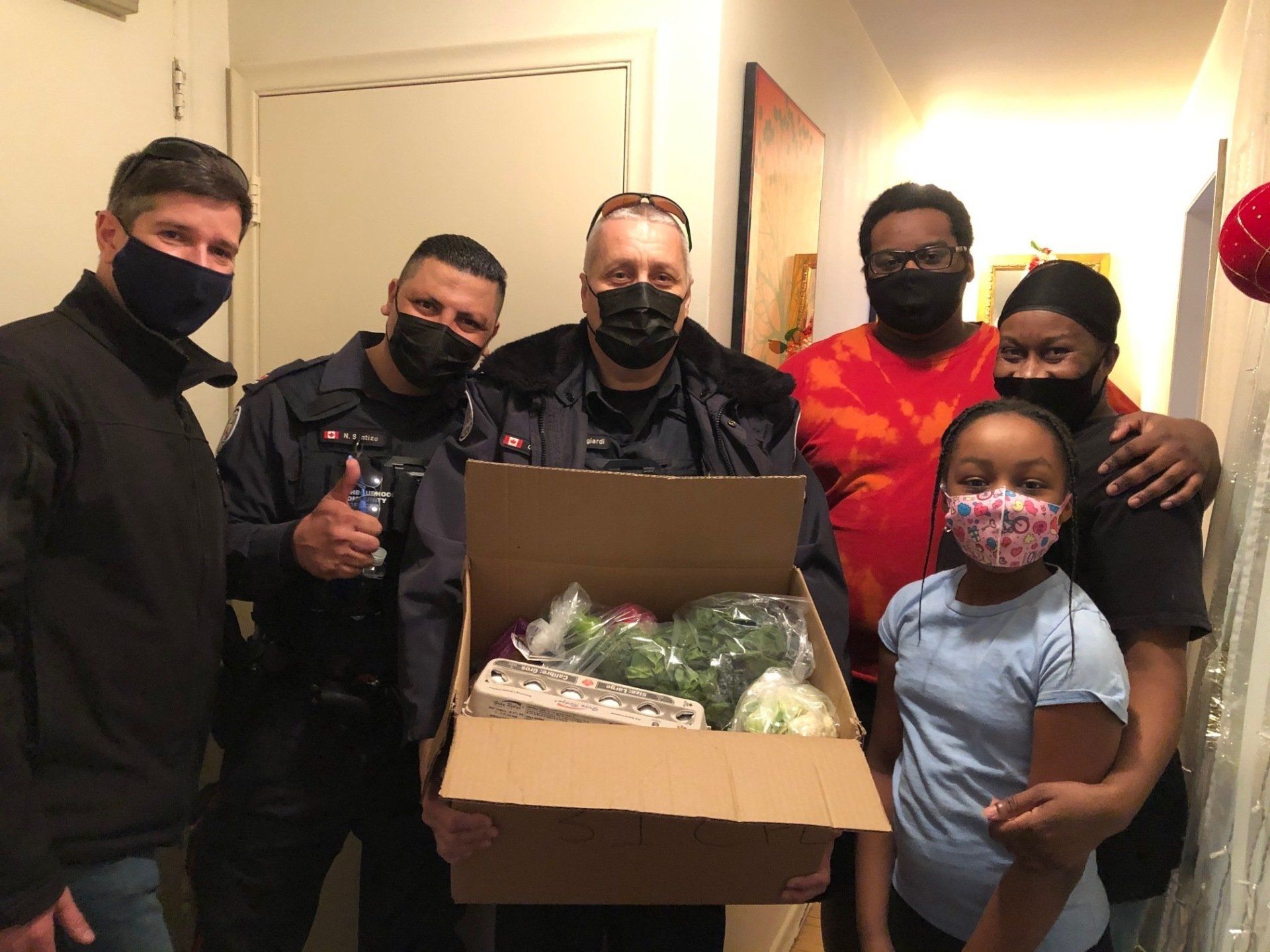 Delivering food hamper to family