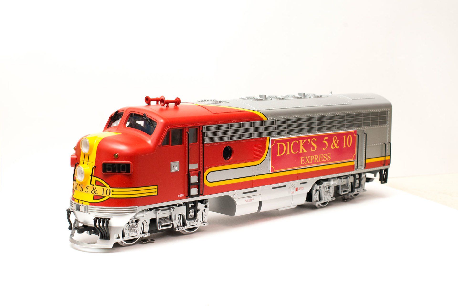A red and silver toy diesel locomotive engine labeled