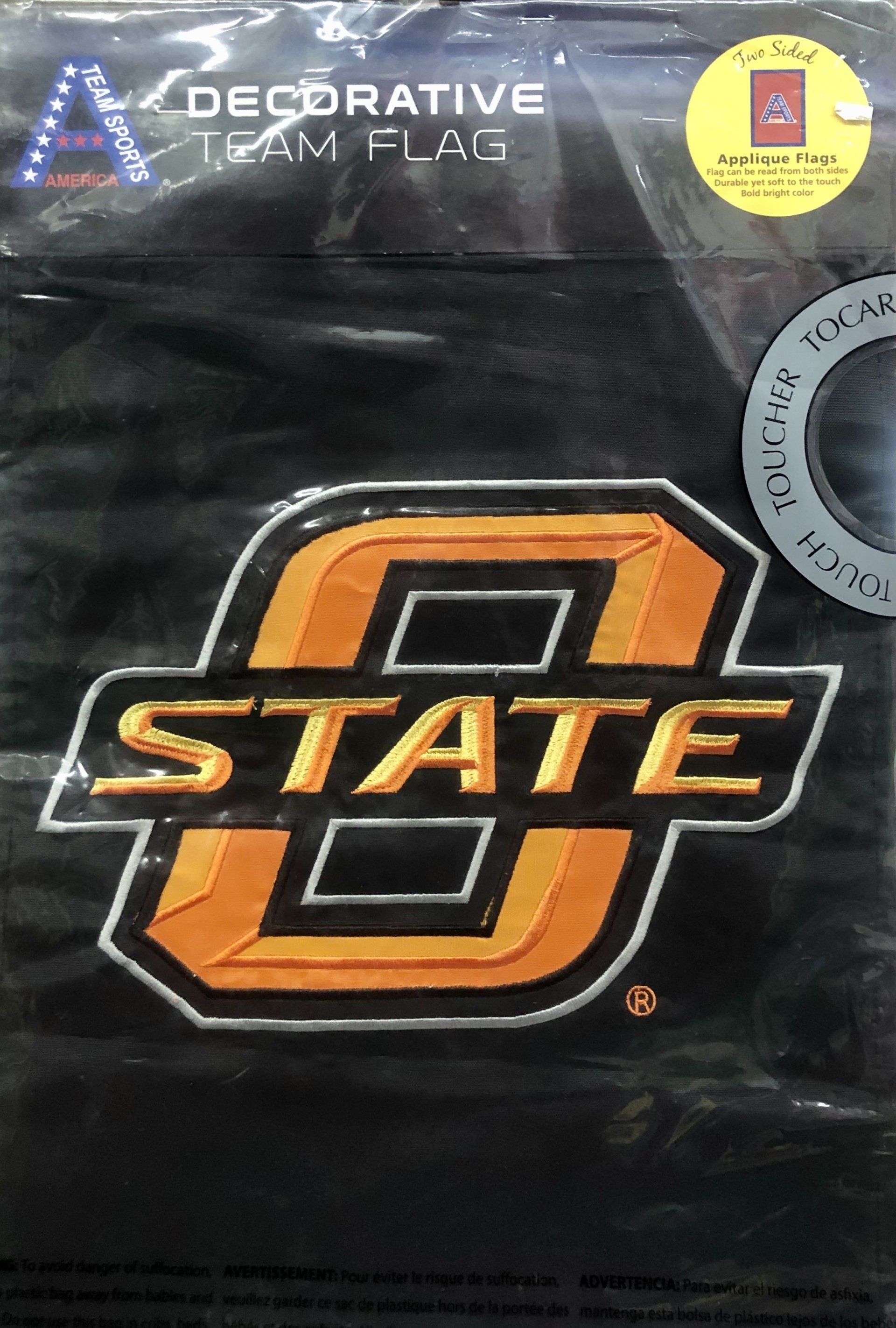 A black decorative flag featuring the orange Oklahoma State University 