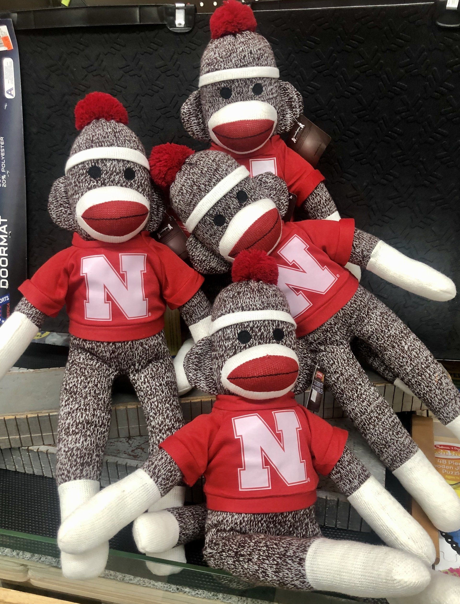 Four sock monkeys with red 