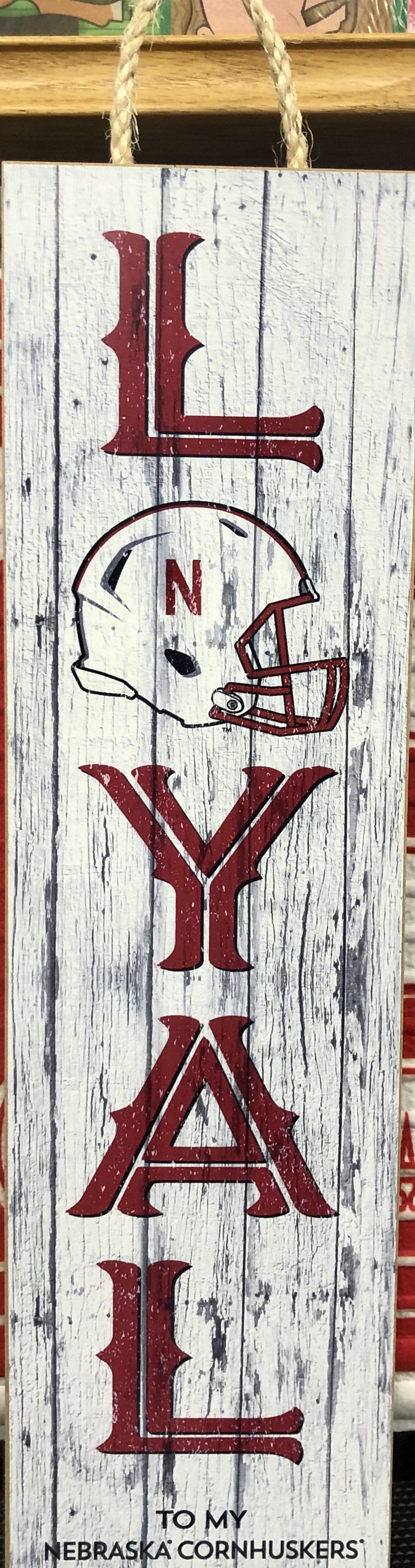 A rustic wooden sign spelling 