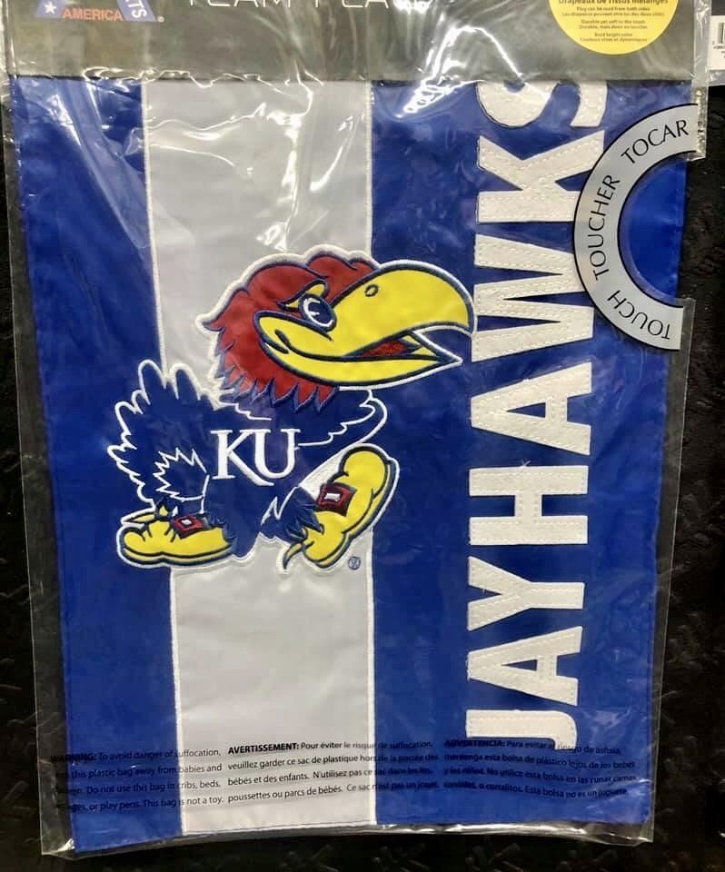A University of Kansas Jayhawk garden flag featuring the blue and yellow mascot and the word 
