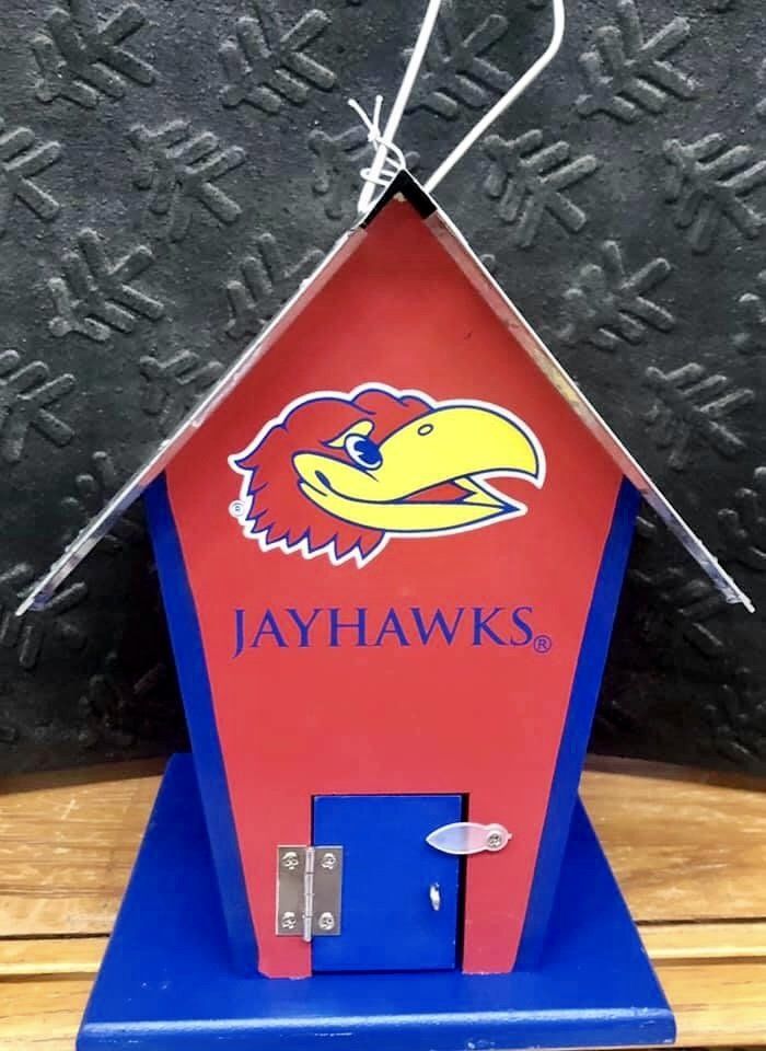 A red and blue birdhouse featuring the Kansas Jayhawks logo and the word 