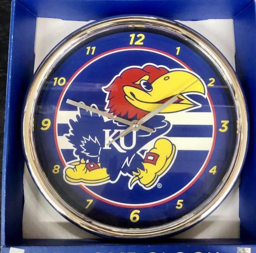 A circular wall clock featuring the Kansas Jayhawks mascot, 