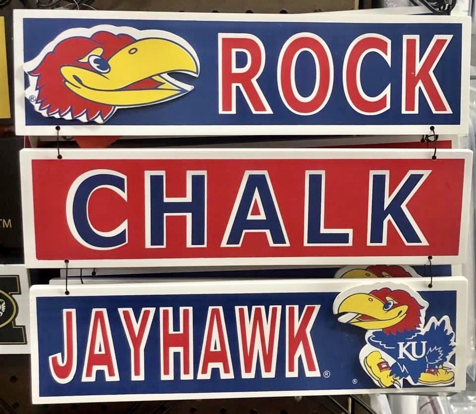 A three-piece wooden hanging sign reading 