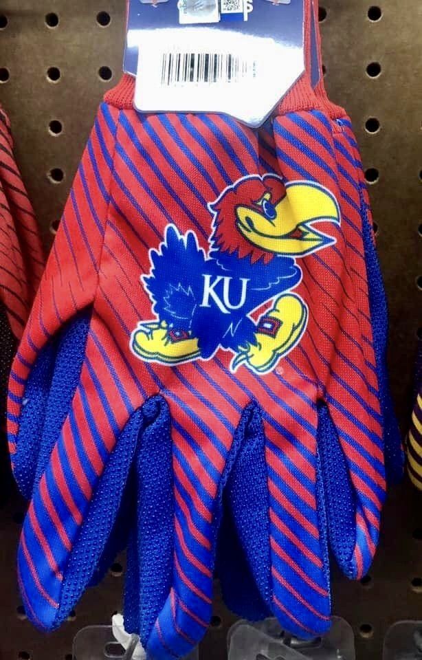 A glove featuring the red and blue Kansas Jayhawk logo with diagonal red and blue stripes on a pegboard display.