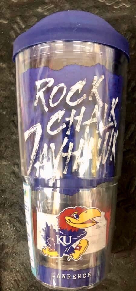A clear plastic tumbler with a blue lid featuring the text 