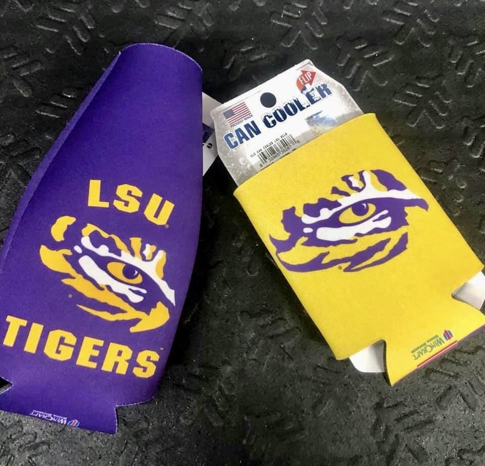 Two Louisiana State University (LSU) themed can coolers, one purple and one yellow, displaying the tiger eye logo.