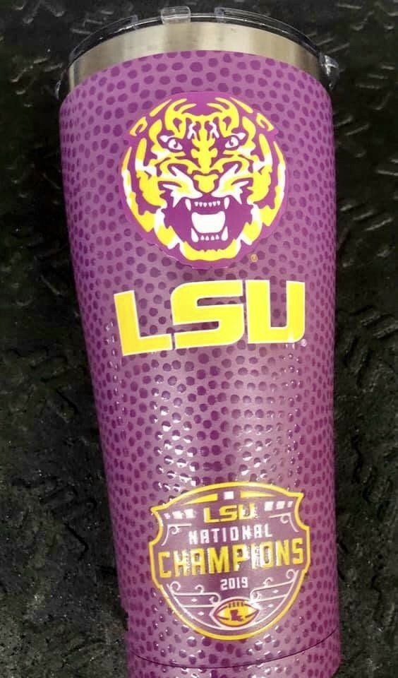 A purple tumbler featuring an LSU tiger logo, 