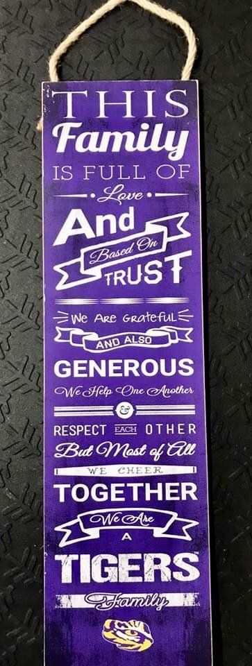 A purple wall sign reads, 