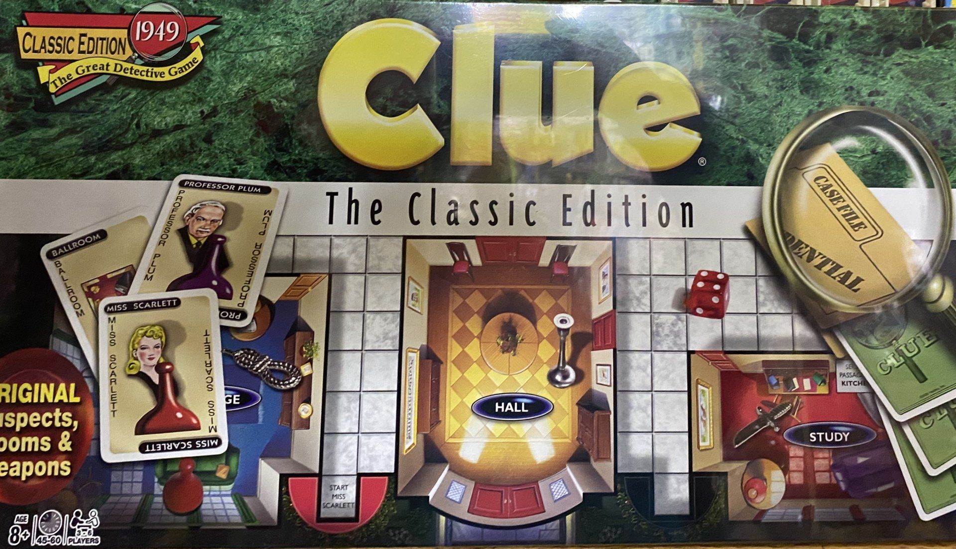 Box cover for Clue: The Classic Edition board game, featuring cards, a magnifying glass, dice, and room layouts.