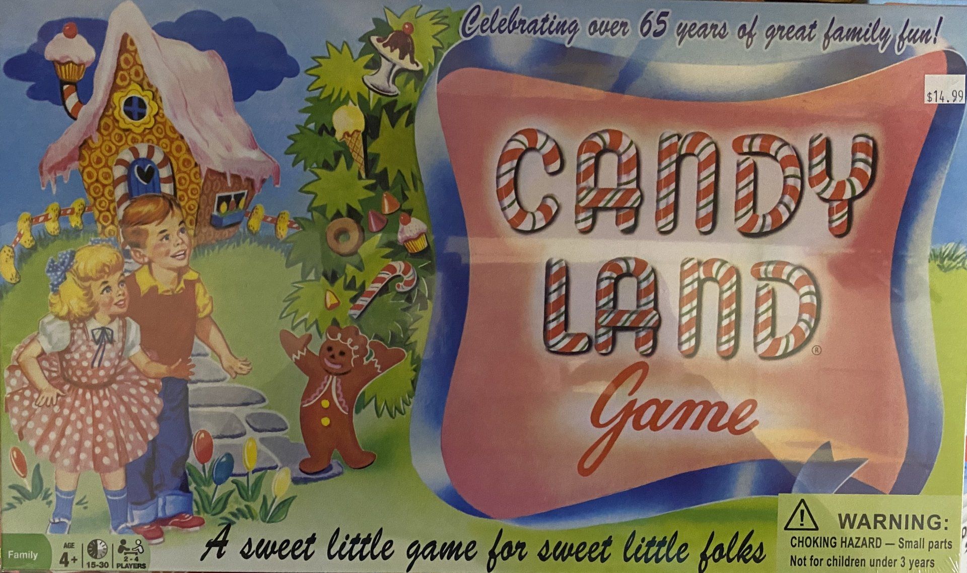 The Candy Land game box shows a gingerbread man, two children, and a candy-themed house against a soft, colorful background.