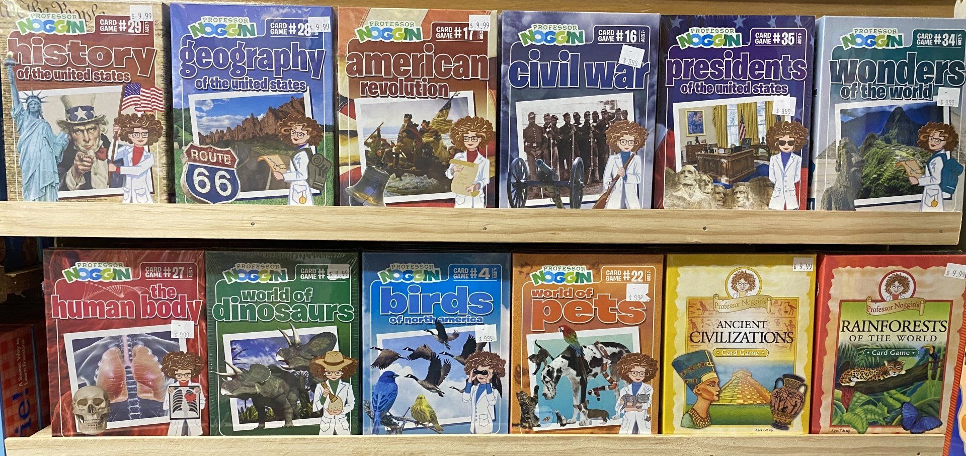 Two shelves filled with Magic Tree House non-fiction fact tracker books displayed on a store shelf.