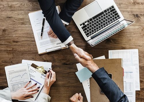 Accounting Firm — business Handshake In The Office In Treasure Coast, FL Accounting Firm — business Handshake In The Office In Treasure Coast, FL