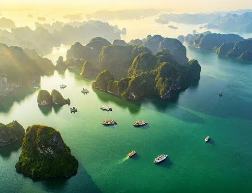An aerial view of a large body of water surrounded by islands and boats.