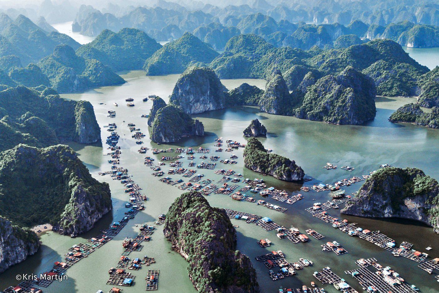 An aerial view of a large body of water surrounded by mountains