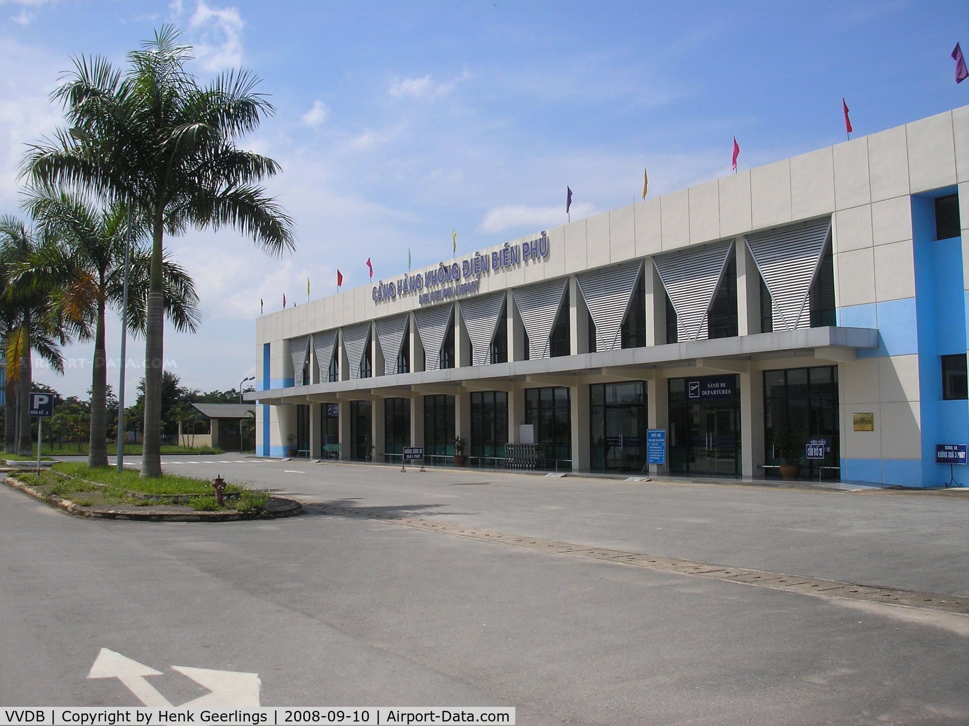 A large building with a palm tree in front of it