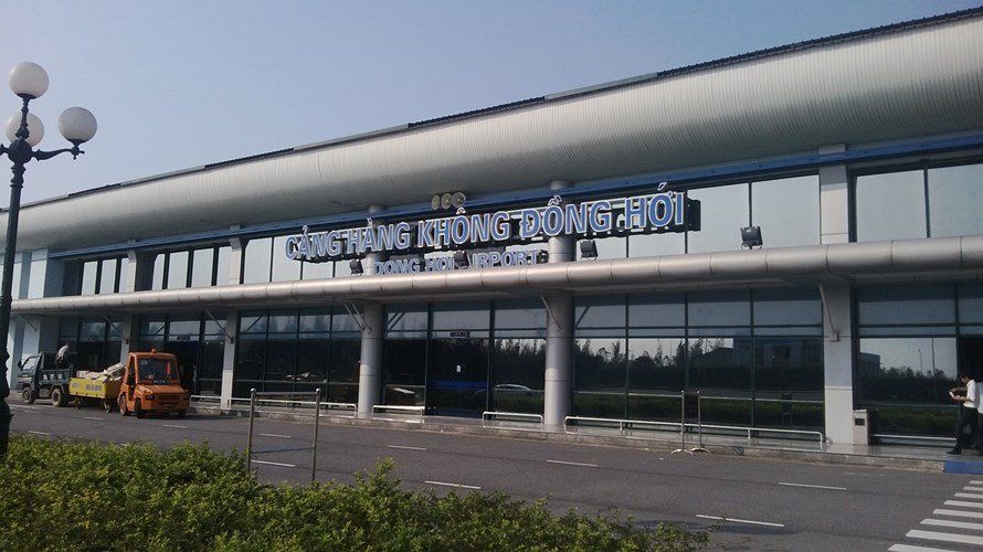 A large building with a lot of windows and a sign on it