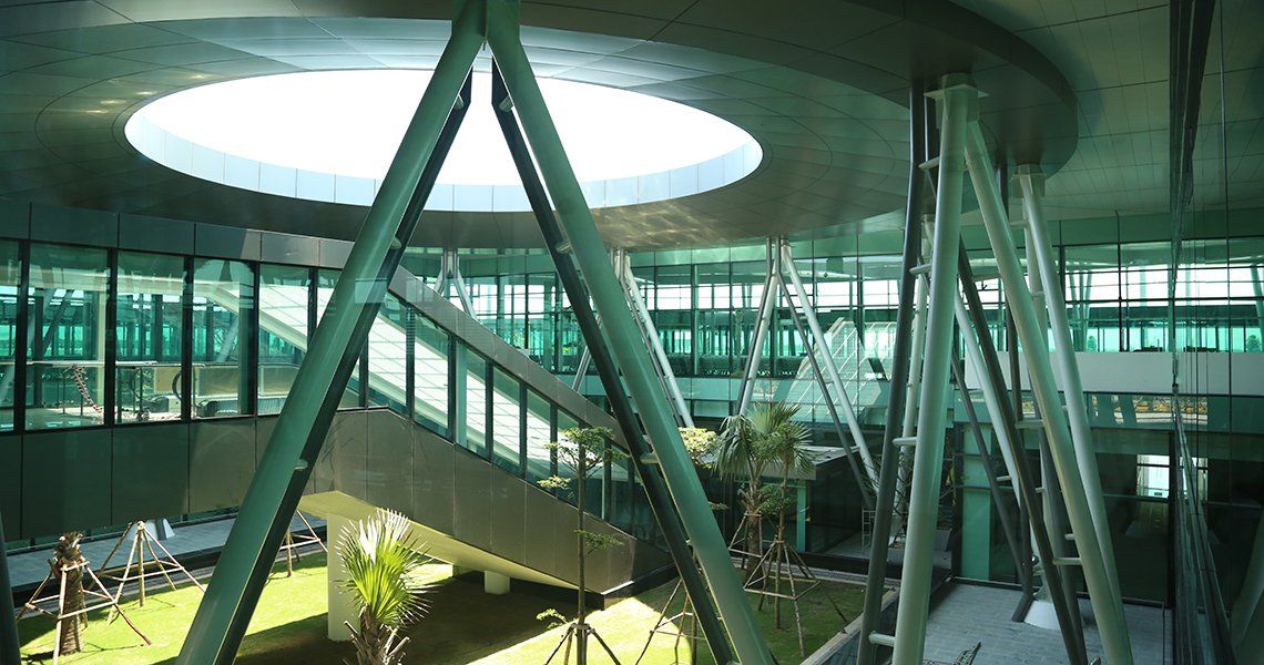 A large building with a lot of windows and a circular ceiling.