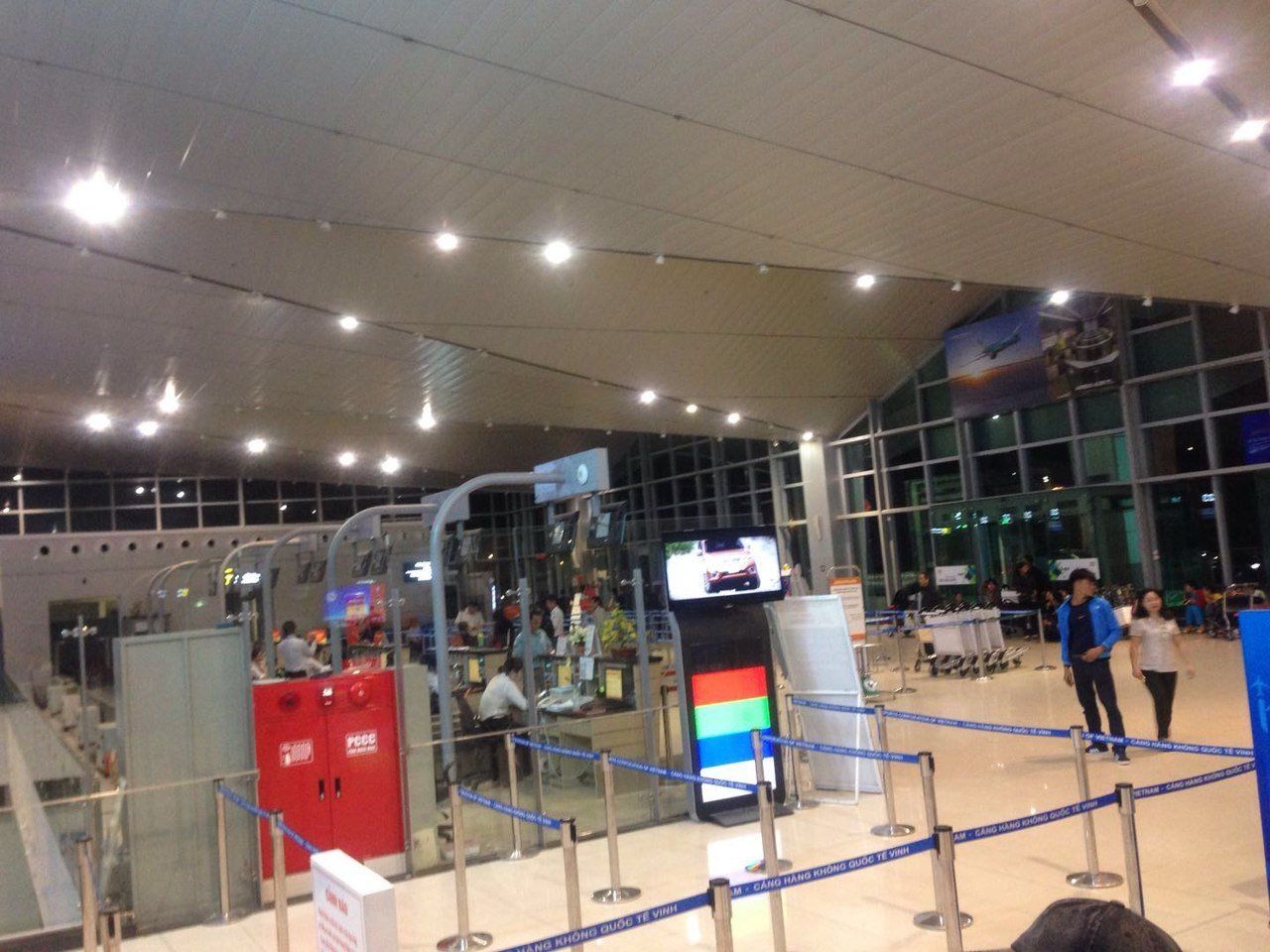 A person standing in a line at an airport