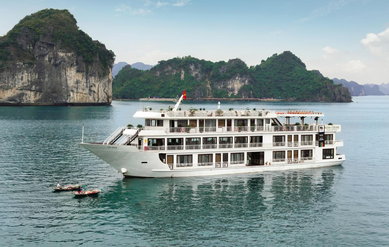 A large white boat is floating on top of a body of water.