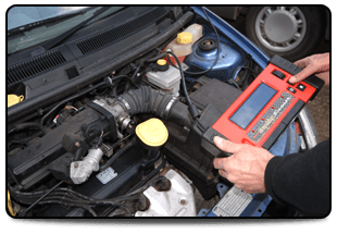 For auto electrical diagnostics in Manchester, call G.S.A. Auto Electrics Person with an electrical device testing a vehicle