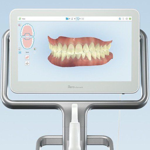 A computer monitor with a picture of a person 's teeth on it.