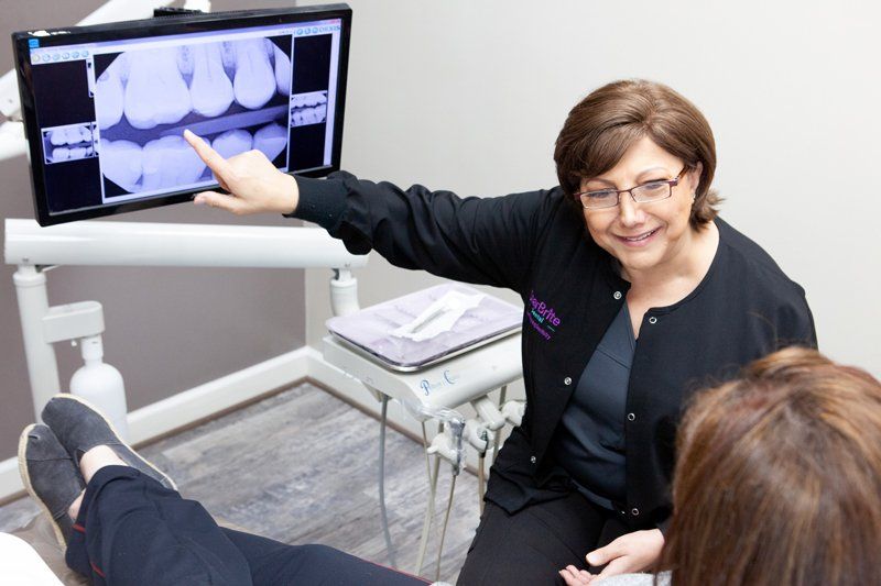 Pictures of Rockville dentist Dr. Maryam Seifi, the StarBrite Dental office staff, smile people and before and after pictures of StarBrite Dental patients.