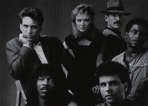 A black and white photo of a group of people posing for a picture.