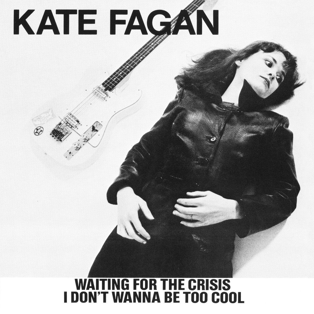 A black and white photo of a woman with a guitar by kate fagan