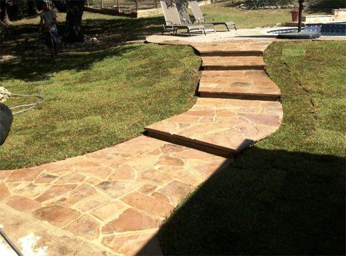 Stone walkway leading to patio