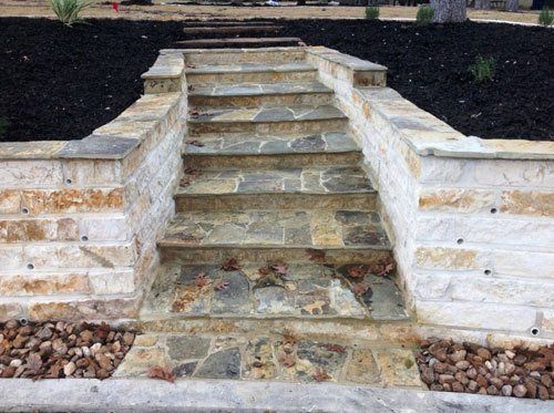 Stone steps and mulched garden bed