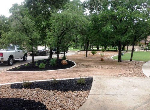 Stone work and mulched garden beds