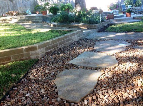 Stone walkway on landscaped property