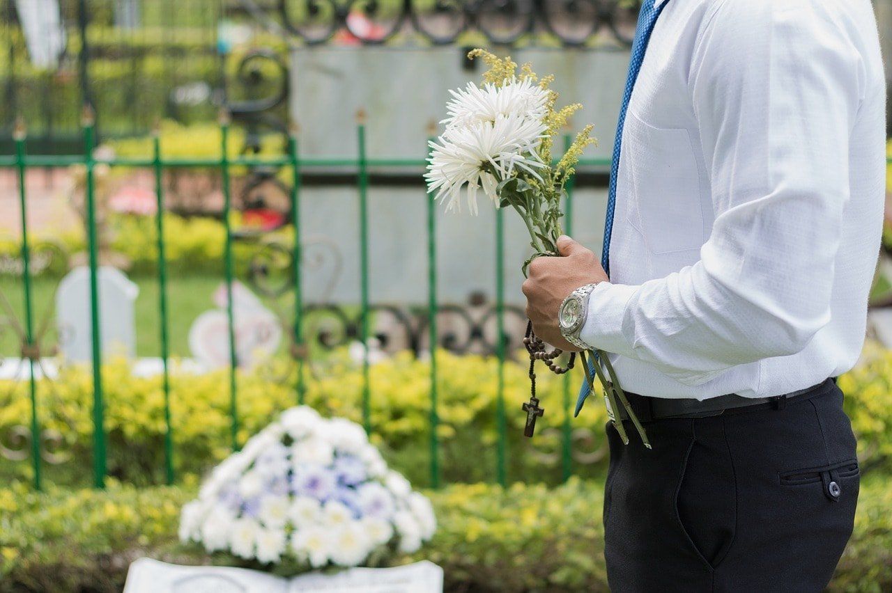 man honoring a loved one at a funeral service