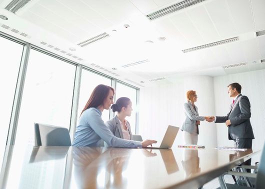 Business people shaking hands at a meeting