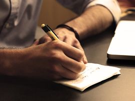 Business man taking notes
